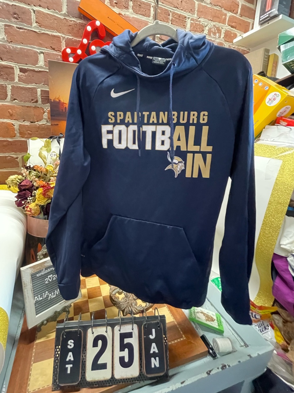 navy blue Nike Spartanburg Football pullover hoodie with a Viking logo.
